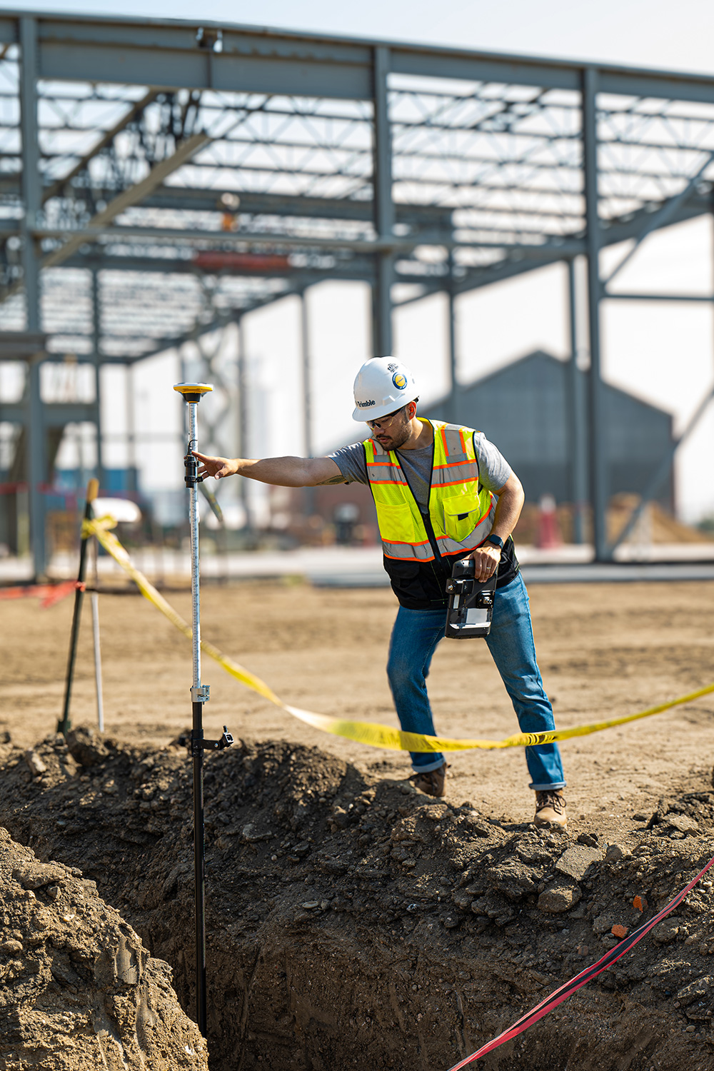 Man using trimble catalyst on a construction site