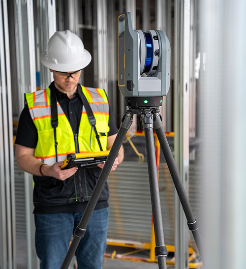 Trimble X9 laser scanning system with operator working on T10x tablet